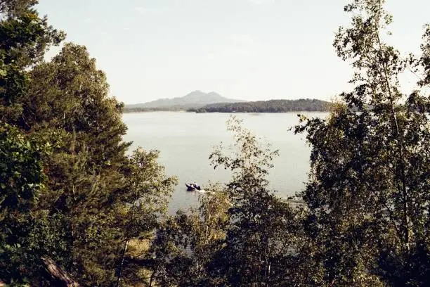 Photo of Machovo jezero lake on 9. September  2023 on analogue photo  - blurriness and noise of the scanned 35mm film were intentionally left in the image