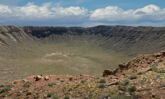 Over 50,000 years ago, a gigantic meteorite weighing several hundred thousand tons impacted the earth near Flagstaff, Arizona.  The force of the impact was a hundred times greater than an atomic bomb, resulting in the huge crater pictured here.