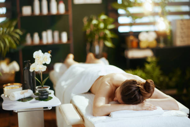istock relaxed 40 years old woman in spa salon laying on massage table 1988228748