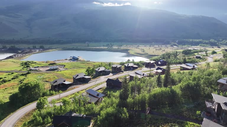 large luxury homes in the countryside of Silverthorne colorado in the early morning light AERIAL DOLLY LOWER