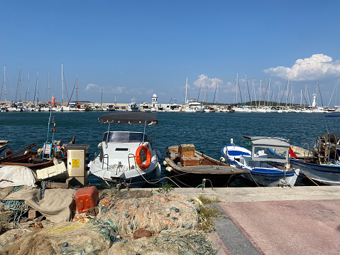 Urla, Izmir, Turkey 10, Sept,2023 : Small port of Urla with fishing and touristic daily boat tour yatchings. Urla is popular tourist attraction in Seferihisar, Izmir, Turkey.