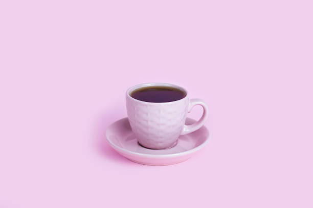 istock Cup of coffee on the pink background. Copy space. Close-up. 1988305269