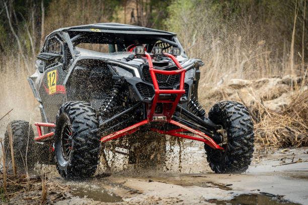 istock ATV/UTV/4x4 off-road vehicle in muddy water 1988307378