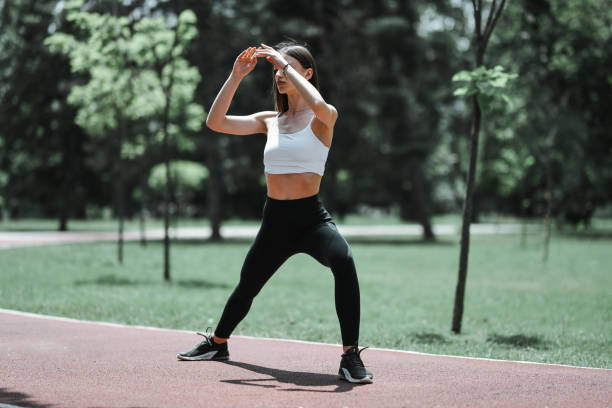 Lateral Squats Performed By Female Athlete In Park