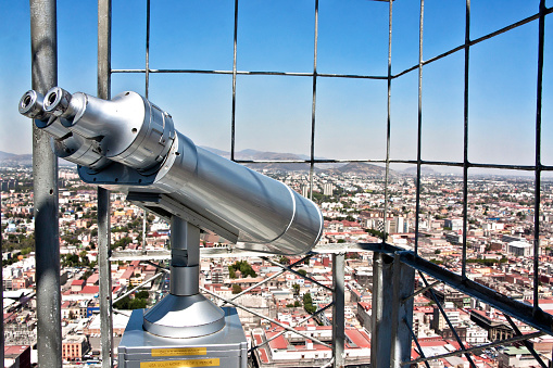Tourist telescope with panoramic view of Mexico City, old metal binoculars at the viewpoint of the Latin American tower overlooking Mexico City, CDMX