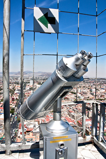 Tourist telescope with panoramic view of Mexico City, old metal binoculars at the viewpoint of the Latin American tower overlooking Mexico City, CDMX