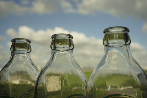 glass bottles, by the window