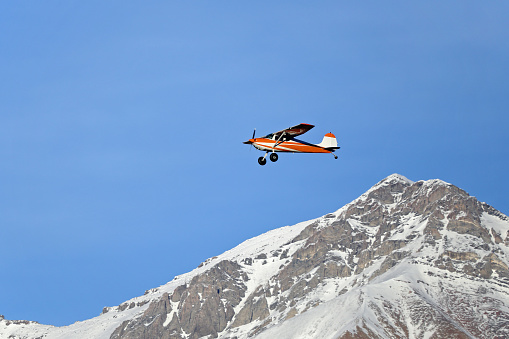 Cessna 140 flying through the Lost River Mountains in East Central Idaho.