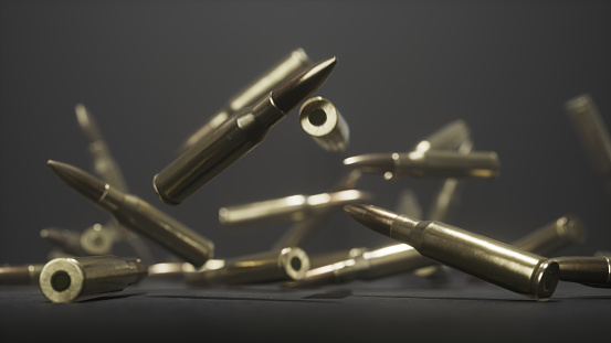 3D rendering of many bullets falling on a floor collecting into a pile