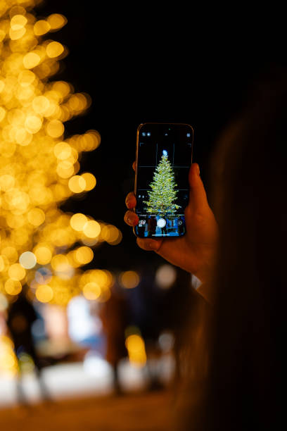 istock Capturing Christmas Tree Lights on Smartphone 1988429757