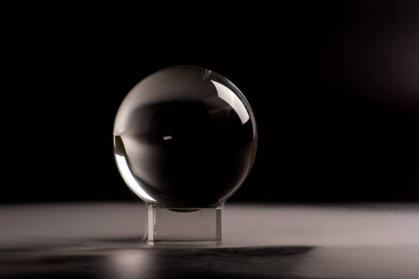 crystal ball, beautiful crystal ball with smoke on black background, selective focus.