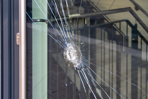 Burglary with broken glass on a door