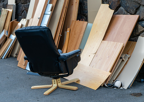 Bulky waste with office chair for recycling on the street