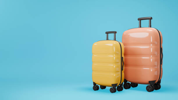 istock Two traveling suitcases on blue background. Large and small cases with luggage. 3D rendering. 1988580053