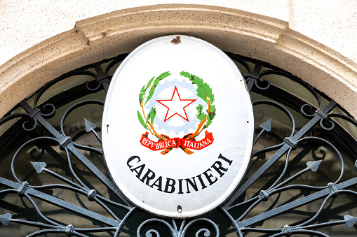 Trieste, Italy - April 08 2019: Metal sign at the entrance door of a police station stating \