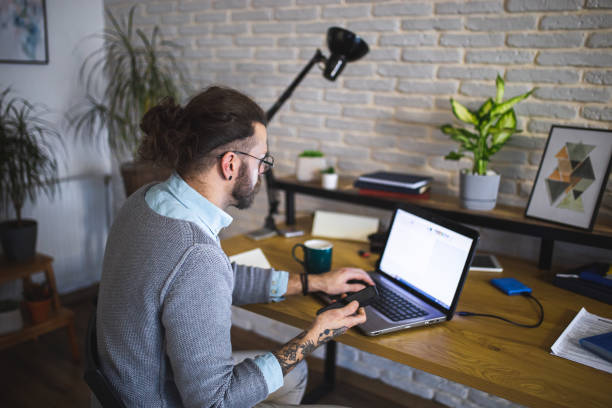 istock Young businessman working at home office 1988617519