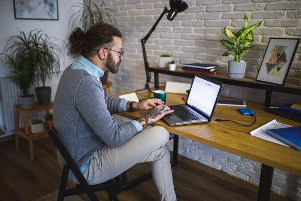 istock Young businessman working at home office 1988628361