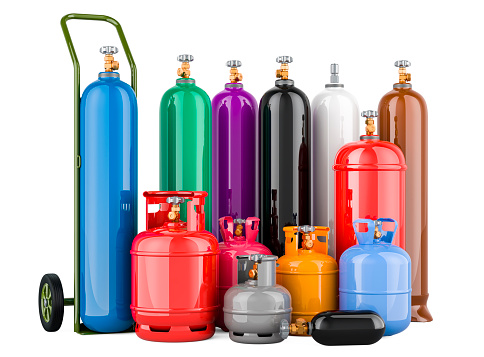Set of different industrial liquefied gas cylinders with hand truck. Delivery Service, concept. 3D rendering isolated on white background