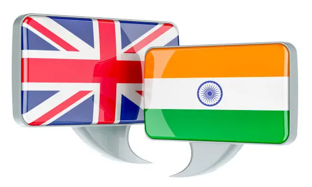 Photo of Speech balloons with British and Indian flags. English-Indian conversation concept, 3D rendering