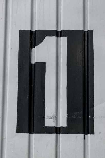 istock Number one painted on a door close up 1988691813