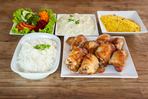 BBQ chicken with complements - Salad, vegetable mayonnaise, rice and fries