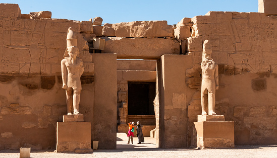 Luxor, Egypt - March 01, 2019: ancient sandstone statues, Karnak Temple, Hall of caryatids. Luxor, Egypt