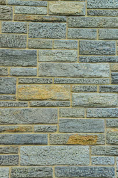 Antique brick wall made of natural stone.