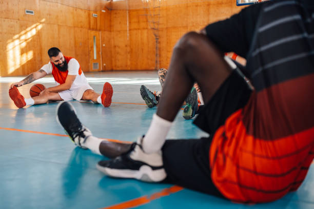 istock A multicultural basketball team is warming up on court during training. 1988812120