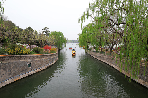 Beijing, China - April 11, 2021: tourists take pleasure boats in the park.