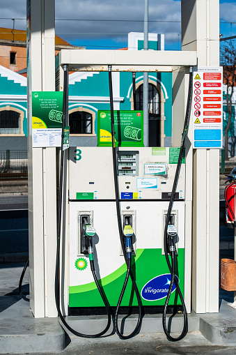 Lisbon, Portugal - Feb 10, 2018: Front view of gas pump BP British petroleum with Ultimate formula - gas station with no customers on a warm winter day in Lisbon