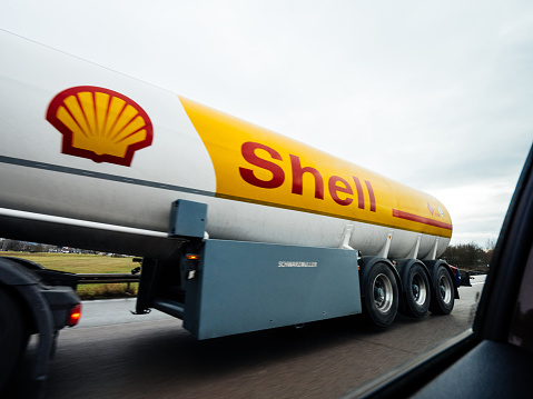 Hamburg, Germany - Jan 26, 2019: View from the car at driving nearby Shell gas tanker trailer with immense logtype of the petrol gas oil company