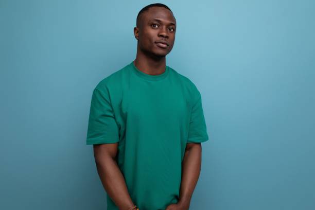 istock young successful handsome handsome american guy dressed in basic t-shirt isolated with copy space background 1988829362