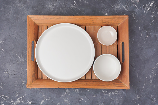 table set of plates and trays with ge background