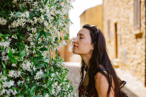 Female tourist traveling in Casale Maritimo, one of the beautiful old towns in Tuscany, enjoying the day.