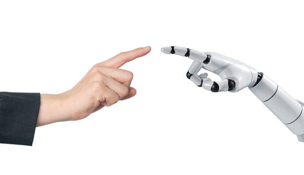 istock Ai hand with human hand trying to touching each others isolated on white background. 1988844498