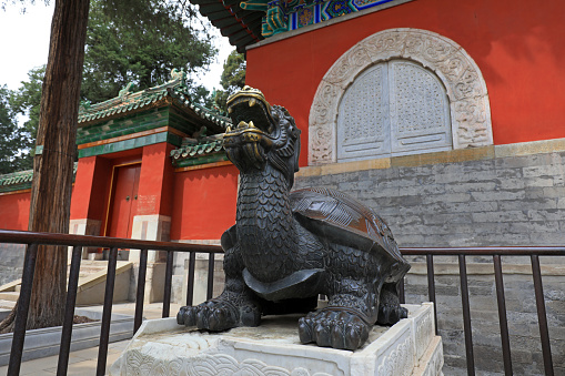 The beast sculpture is outside a temple, Beijing