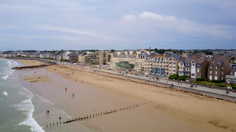 Flying by the beach and looking at the facades of the houses by the sea