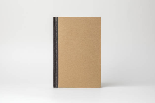 istock Blank Kraft Notebook Standing Upright on a White Background in Studio Lighting 1988919683