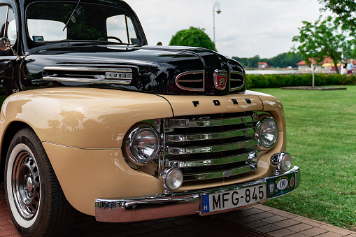 First generation Ford F-Series (F-1, 1948-1950 year)  - cabin and grill details close up. 02.07.2023 - Serbia, Palic.
