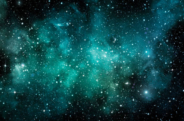 istock Turquoise galaxy on the atmosphere with stars on a dark background. 1988933517