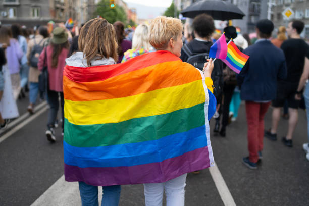 istock A LGBTQI couple wearing flags during pride event 1988936798