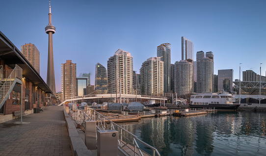 A morning view of the Toronto Harbourfront Centre area.  This district attracts downtown residents and tourists to its many attractions, events, beautiful waterfront, bars, restaurants and shops.