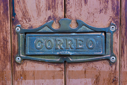 Close up of handle and combination lock on vintage safe