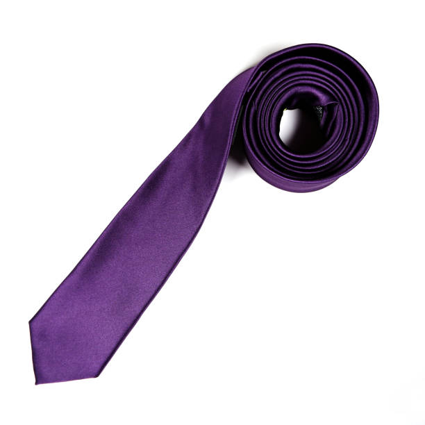 istock A purple color polyester fabric necktie rolled on white background close-up view single object flatlay concept no people 1989139461