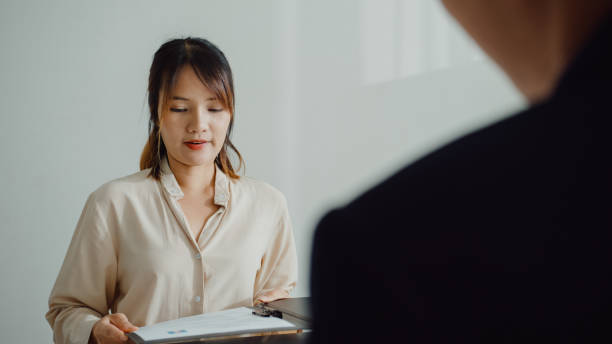 young asian woman pass job interview sit in front of hr manager at office. human resource, recruitment agency. - discussion interview talking place of work zdjęcia i obrazy z banku zdjęć