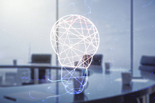 istock Abstract virtual light bulb hologram on a modern boardroom background, idea concept. Multiexposure 1989207960