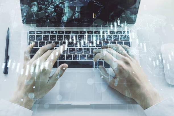 istock Multi exposure of abstract creative financial chart with world map and with hand typing on computer keyboard on background, research and analytics concept 1989208659