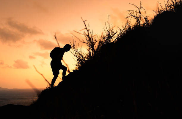 istock Active senior man hiking at sunset. 1989223529