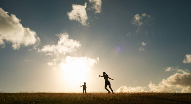 istock Mother and daughter having fun in the park. 1989224559