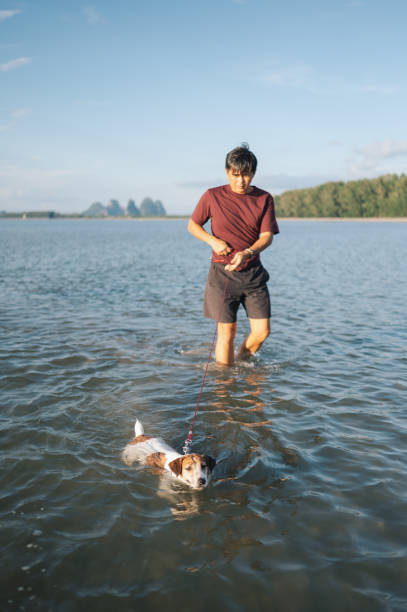 istock Single asian men with his dog 1989235479